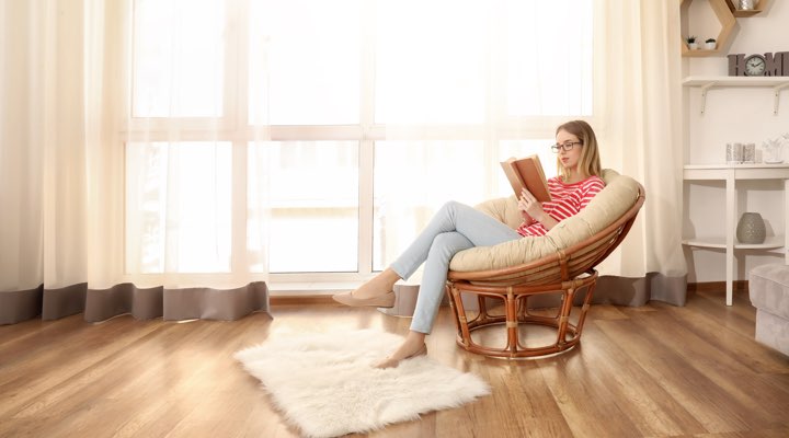 Photo of woman relaxing in spacious room